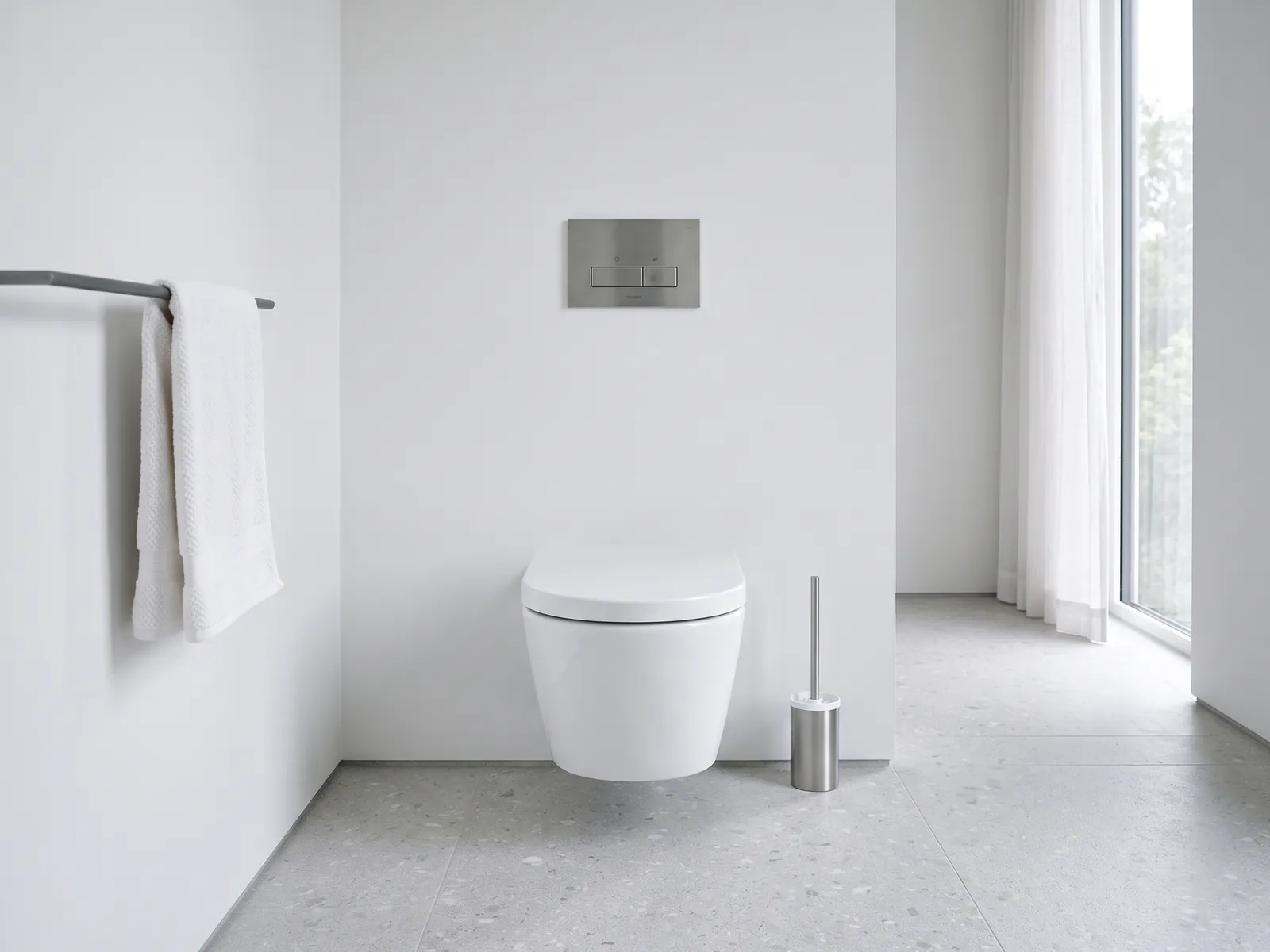 White wall-hung toilet floating above a continuous stone floor