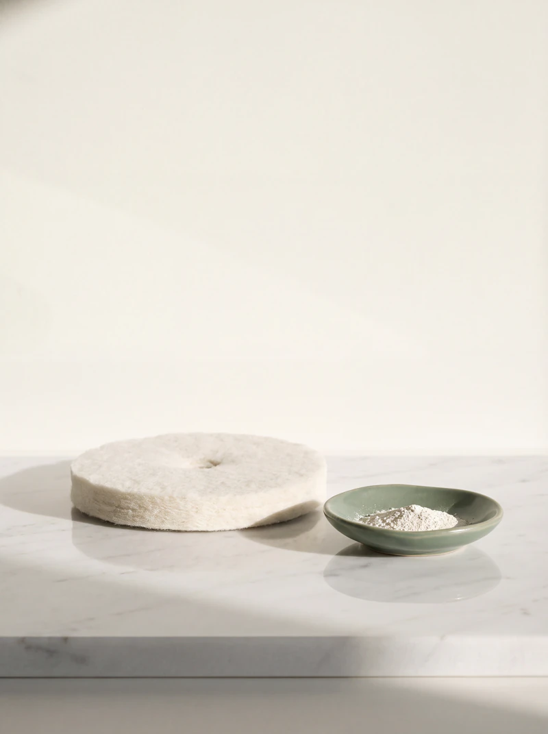 Buffing pad mirrored in high-gloss white KalingaStone marble